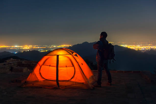istock Hikers and his tent in the Great Wall under the stars 857418912