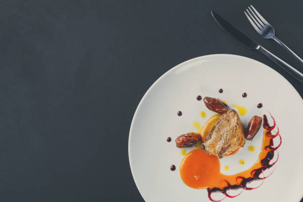 istock Roasted goose liver with date fruit and apple 857422042