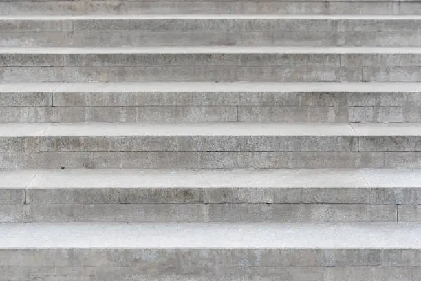 Photo of Row of the gray concrete stairs