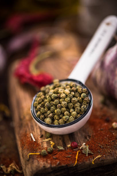 istock Green pepper whole seeds on spoon 857426024