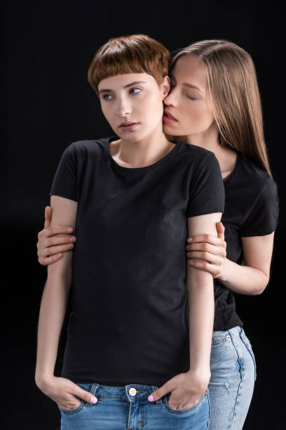 istock Young woman embracing girlfriend 857430394