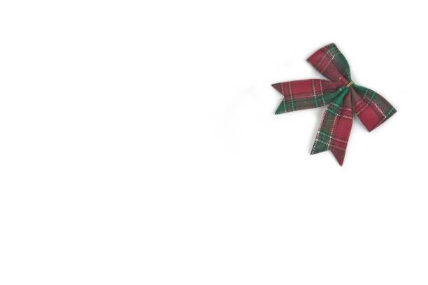 istock Christmas background with decorations  holly and present boxes, ribbon on white 857434078
