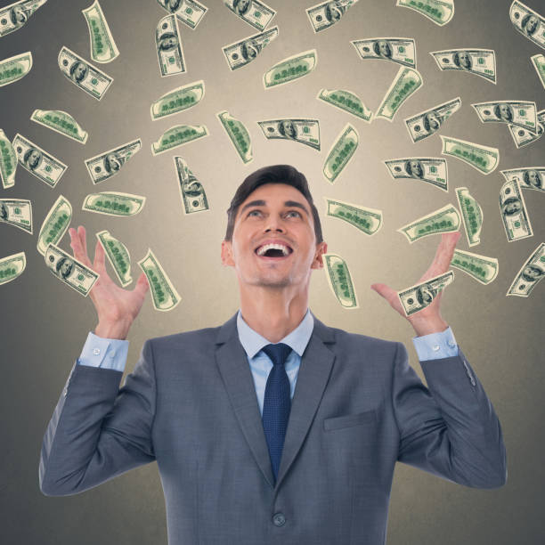 istock Businessman with money rain 857438458