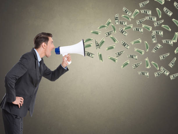 istock Businessman screaming into a megaphone 857439340
