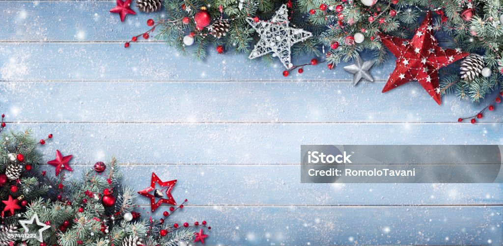 Christmas Background - Fir Branches And Baubles On Snowy Plank Christmas Ornament And Pine Branches On blue Table Christmas Stock Photo