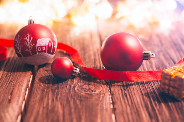 istock Christmas decorations on a brown wooden table with christmas lights 857442480