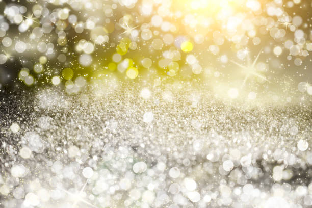 istock Silver light bokeh background. Abstract grey shiny glitter bokeh christmas background 857444858