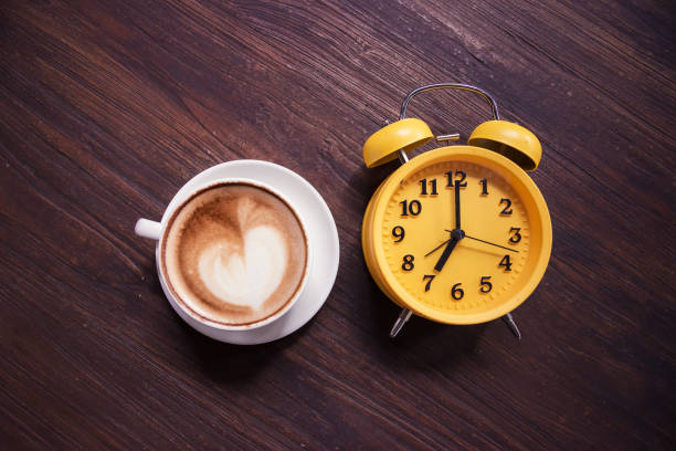 istock Retro Clock with cup of coffee morning 857445274