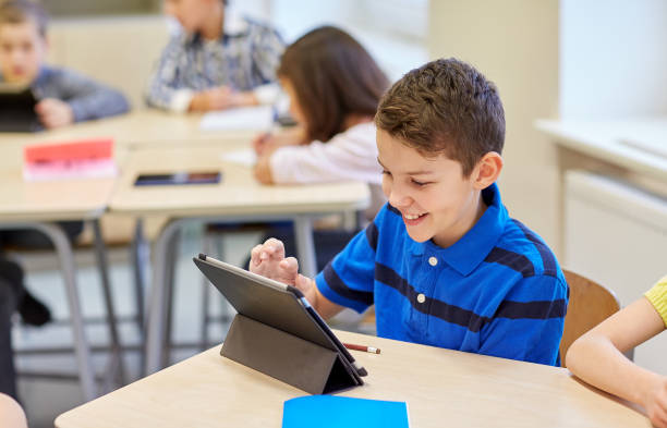 istock school kids with tablet pc in classroom 857445458