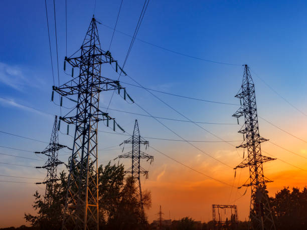 istock Pylons and transmission power lines on the blue sky background. 857446208