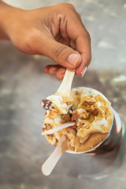 istock Young men enjoy rum raisin ice cream 857449046