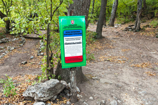 Generalskoe: warning sign in forest in Haphal Gorge with name of Habhal Hydrological Reserve natural park on Crimean Southern Coast of Black sea