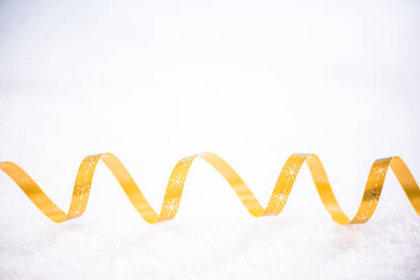 istock Christmas festive golden ribben in snow 857459720