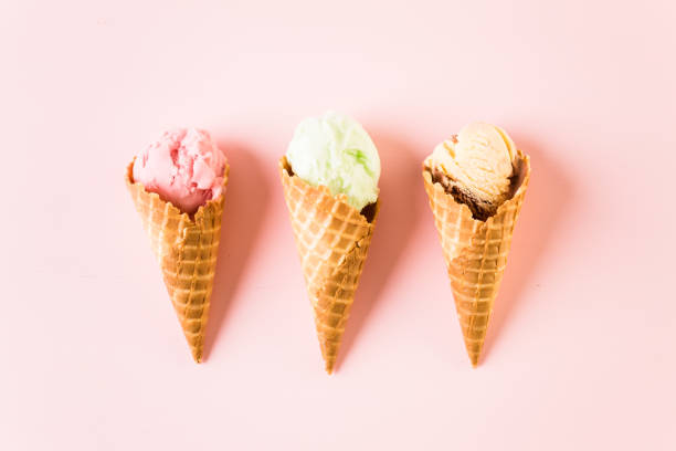 istock Waffle ice cream cones with plate of ice cream scoops 857459880