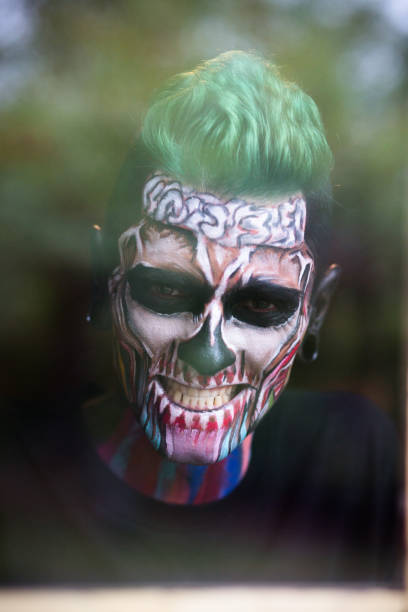 istock Close up portrait of mans face with skeleton makeup 857461014