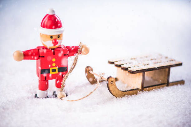 istock Funny Santa in winter scene on snow sledge 857464654