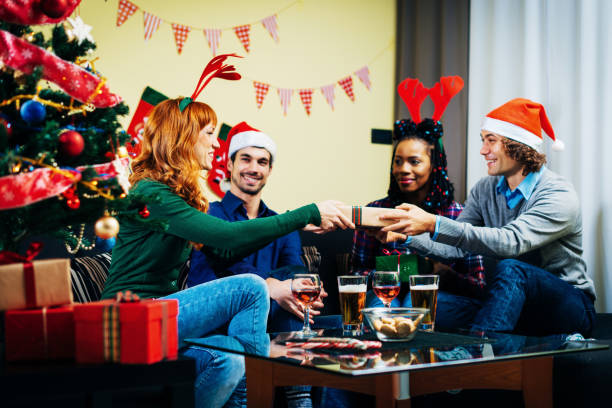 istock Friends exchange presents for Christmas 857465086