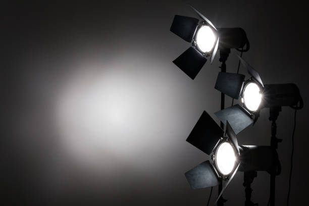 istock Several reflectors on the black background in photo studio. 857467722