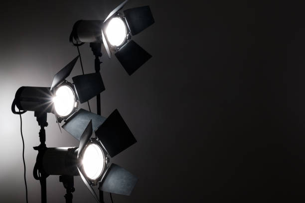 istock Several reflectors on the black background in photo studio. 857467804