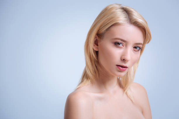 istock Delighted woman standing over white background 857477508