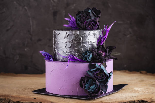 istock Artwork wedding cake with flowers on dark background 857477594