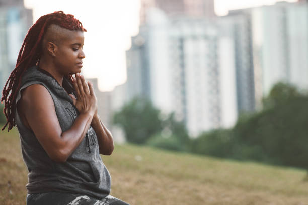 istock meditative yoga in the park 857478240