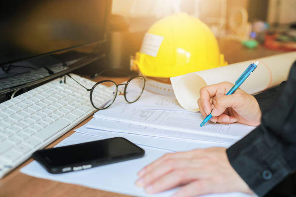 istock Hands of Engineer working on blueprint, Image of engineering. 857478372