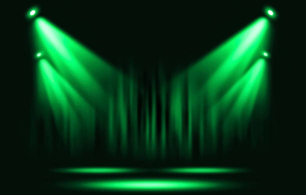istock Stage lights. Green spotlight with certain through the darkness. 857481816