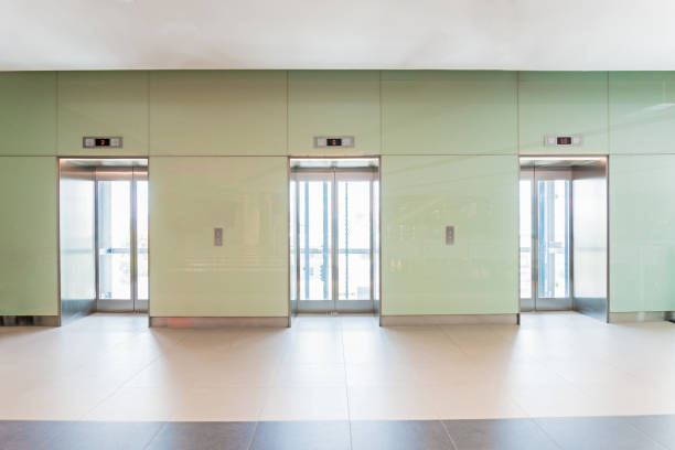 istock Open and closed chrome metal office building elevator doors. 857485062