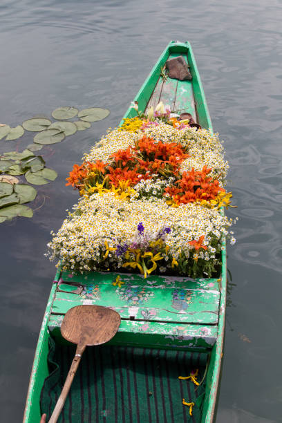 Boat with flowers on Dal Lake in Srinagar. India