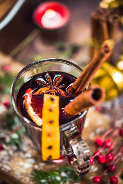 istock Red mulled hot wine in glass with spices 857485838