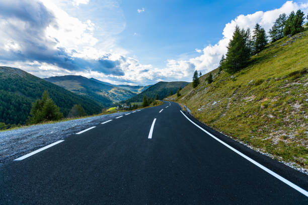 istock Asphalt road in Austria, Alps in a summer day 857489882