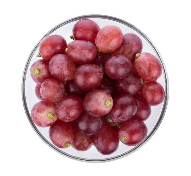 istock Ripe red grape in bowl on white background 857489924
