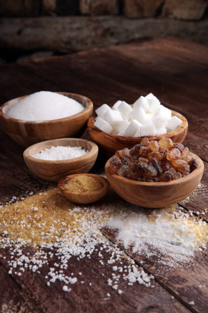 istock Various types of sugar, brown sugar and white on wooden table 857497158