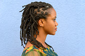 Side view portrait of a woman with dreadlocks