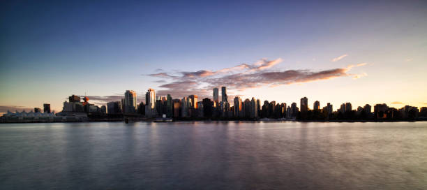 Vancouver skyline at sunset, Canada Vancouver skyline at sunset in Stanley park on a sunny autumn afternoon. shadow british columbia landscape cloudscape stock pictures, royalty-free photos & images