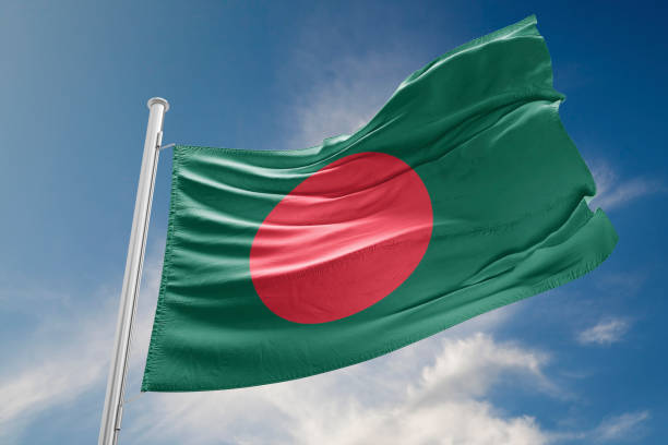 istock Bangladesh Flag is Waving Against Blue Sky 857500990