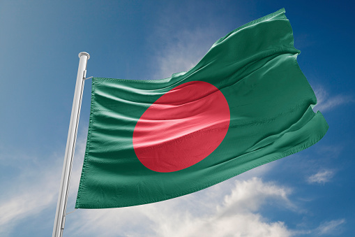 Bangladesh flag is waving at a beautiful and peaceful sky in day time while sun is shining. 3D Rendering