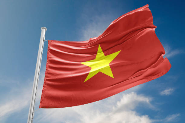 istock Vietnam Flag is Waving Against Blue Sky 857501034