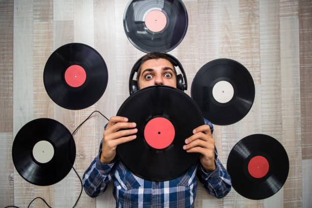 istock man with vinyl records 857501652
