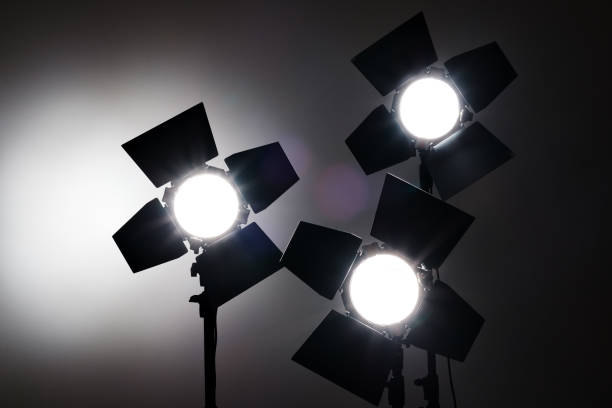 istock Several reflectors on the black background in photo studio. 857501754