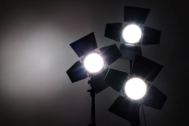 istock Several reflectors on the black background in photo studio. 857501788