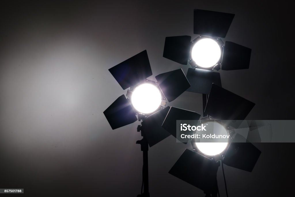Several reflectors on the black background in photo studio. Several reflectors on the black background in photo studio. ready to do professional shooting Camera - Photographic Equipment Stock Photo