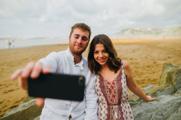 istock Young couple taking a selfie 857505306