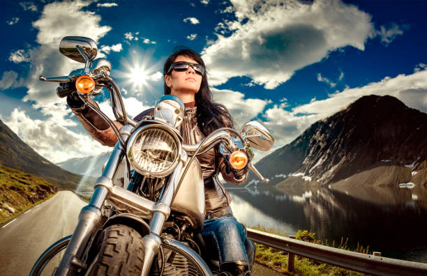 istock Biker girl on a motorcycle 857505780