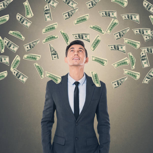 istock Businessman with money rain 857510542