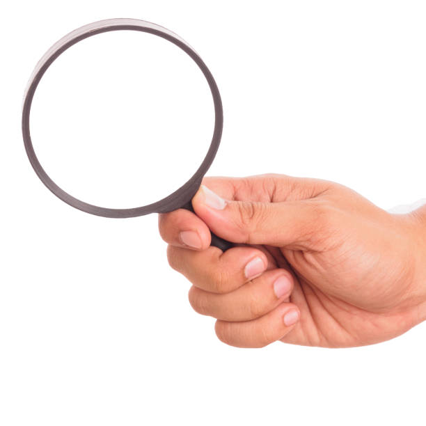 istock male hand holding plastic magnifying glass 857514358