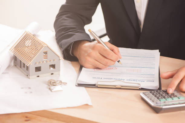istock Mortgage Application Form - Hand Filling The Document Closeup 857526078