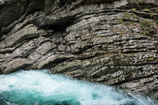 Clean Radovna River Against Rugged Rocks.