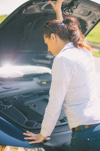 istock Woman and her broken off-road vehicle 857545850